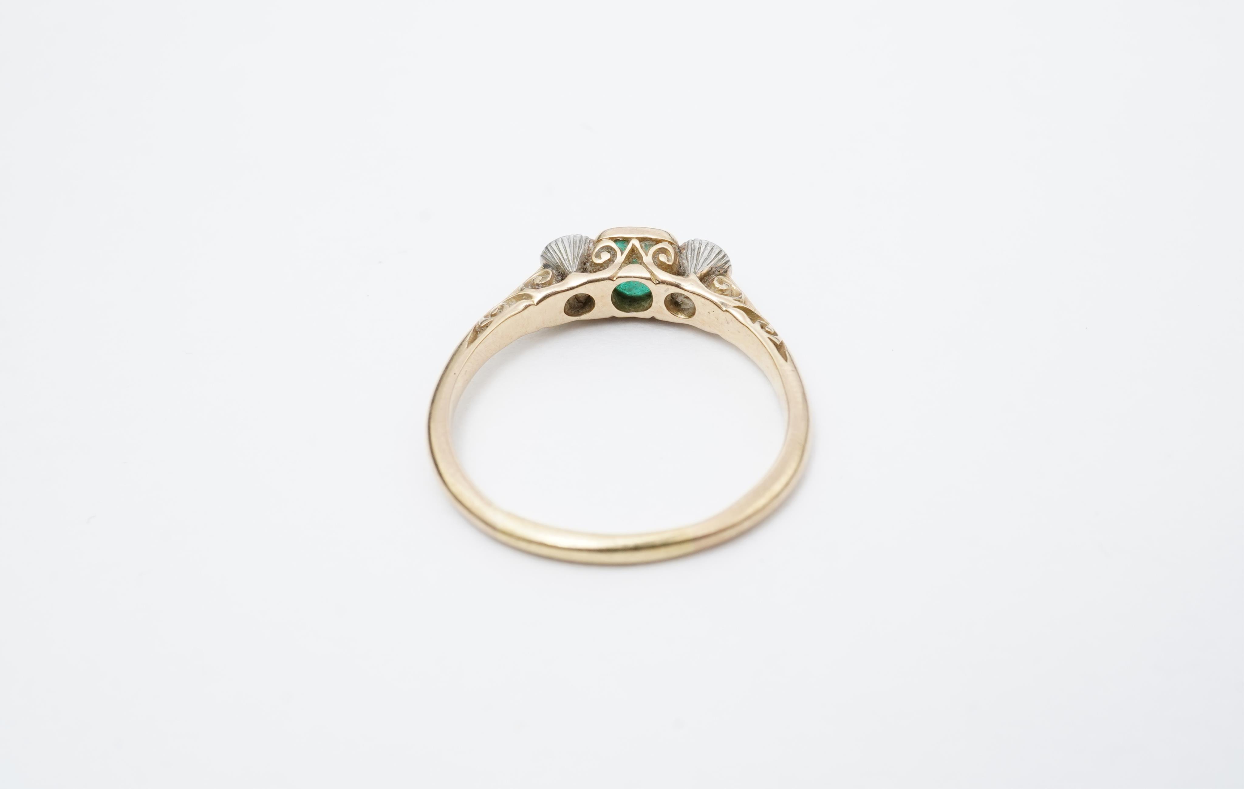 An emerald and diamond ring, early 20th century